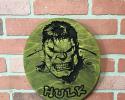 Stained green and black round hulk sign.
price starting at $40.00 each
